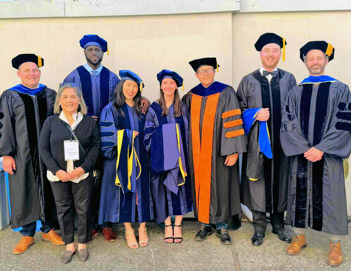 A group of people in graduation regalia